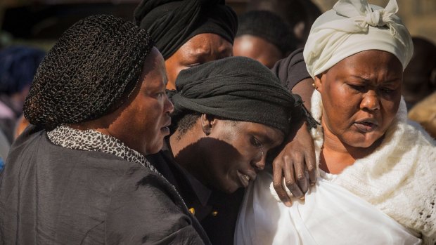 Akon Guode at the funeral for her three children in 2015.