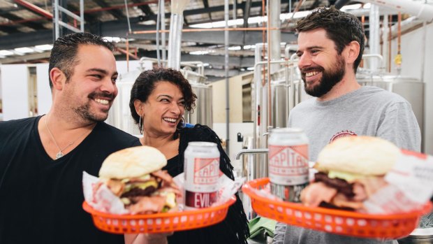 Brodburger's Sascha Brodbeck and Joelle Bou-Jaoude with Captial Brewing Co's Laurence Kain at the annoucement of the partnership between the two at Capital's new brewhouse.