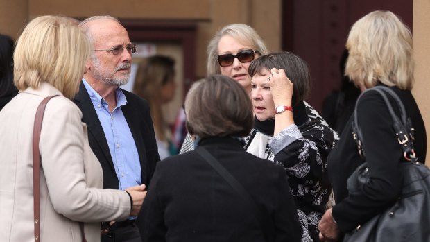 Deidree Huxley (second from right) Morgan Huxley's mother, surrounded by family and friends at the NSW Supreme Court on Wednesday.