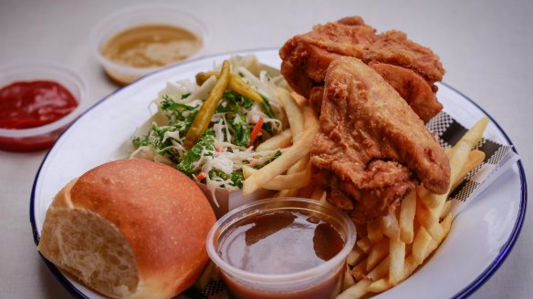 Fried chicken served with fries, coleslaw, bread and gravy at Juanita Peaches.