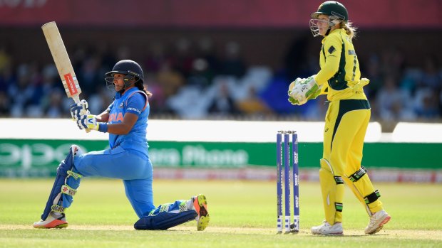 Thunderous knock: India batsman Harmanpreet Kaur hits out during her match-winning innings.