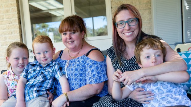 Dionne Barton (left), with Lawrence, 5, and Georgia, 7, and Claire Ormiston, with Samuel, 4, have concerns about Kids Academy Hornsby.