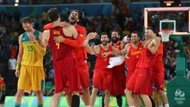 Spain's players celebrate winning the bronze medal match.