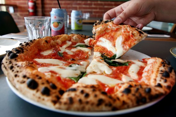 Puffy-crusted margherita pizza.