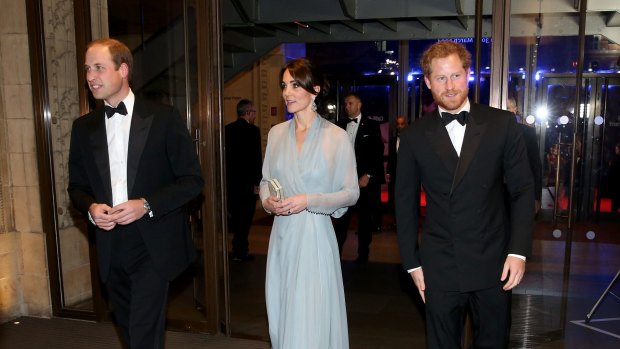 Fashion spy: Prince William, the Duchess of Cambridge and Prince Harry turn out for the Spectre premiere at the Royal Albert Hall in London.