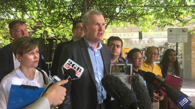 Labor MP Tony Burke (centre) with Senators Sam Dastyari (right) and Jenny McAllister (left) speak to journalists in Bennelong. 