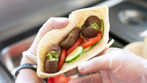 Green taameya in baladi pocket bread.