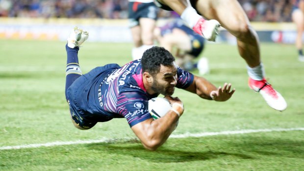 Lightning: Justin O'Neill dives over for the Cowboys in Townsville.