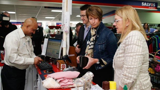 Trash to treasure: Mrs Abbott at the op shop checkout. 