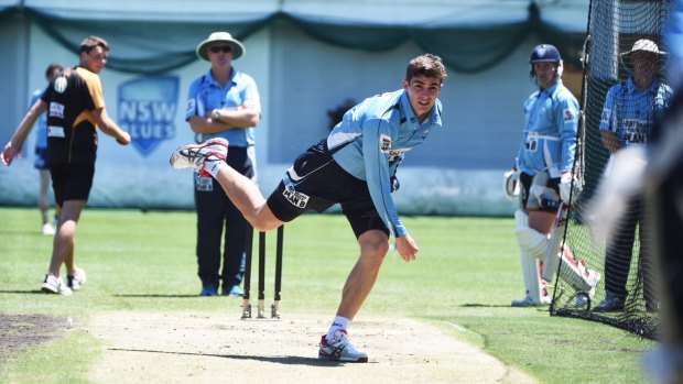 Back in the nets: Sean Abbott sends down a delivery at NSW training.