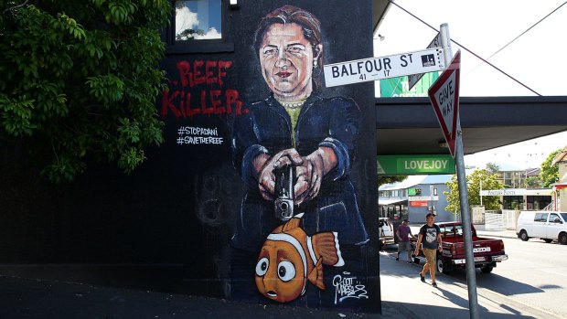Queensland Premier Annastacia Palaszczuk depicted holding a gun to Nemo's head in an anti-Adani street mural in New Farm.