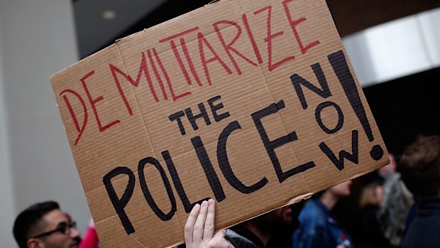 Critical crowd: Demonstrators take part in a protest outside the Office of Police Complaints as part of a planned "28 Hours for Mike Brown" protest in Washington, DC. 