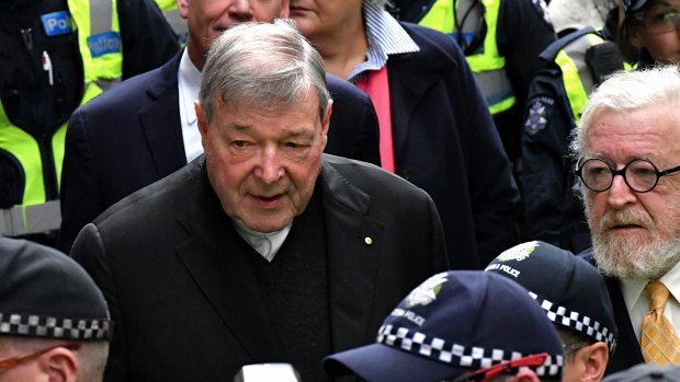 George Pell leaves the Melbourne Magistrates Court in October.