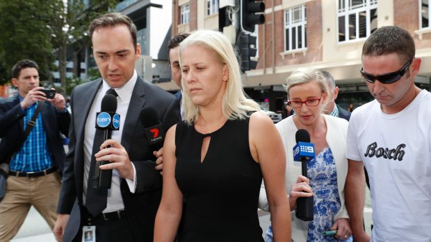 Heidi Strbak (centre) arrives for arraignment for the manslaughter of her four-year-old son Tyrell Cobb in 2009, at the Supreme Court in Brisbane on Wednesday.