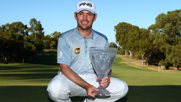 Off to Miami: Louis Oosthuizen of South Africa poses with the trophy in Perth.