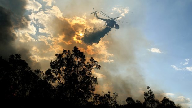 The RFS was ready to attack spot fire flare-ups while air support flew overhead and waterbombed the Abermain fire.