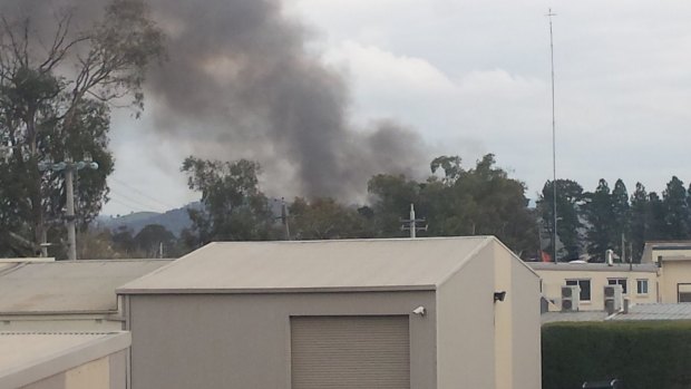 Flames and smoke from mattress fire in Fyshwick.