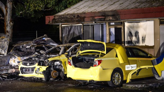 The suspicious fire destroyed a six taxis.