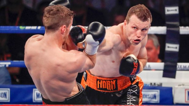 Straight shot: Horn works through the defences of UK boxer Corcoran in Brisbane.