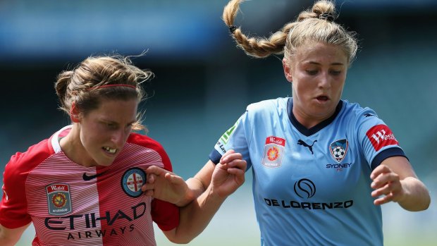 Stalemate: Remy Siemsen of Sydney, right, is challenged by City's Rebekah Stott.