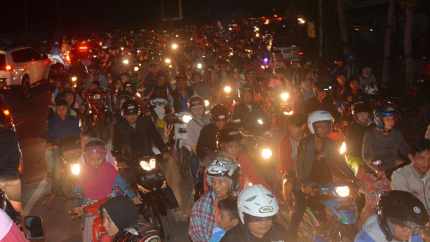 Motorists are stuck in traffic as they try to reach higher ground amid fears of a tsunami, following an earthquake in Cilacap, central Java.