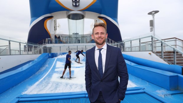 Royal Caribean managing director Adam Armstrong in front of the Flowrider aboard the Ovation of the Seas cruise ship.