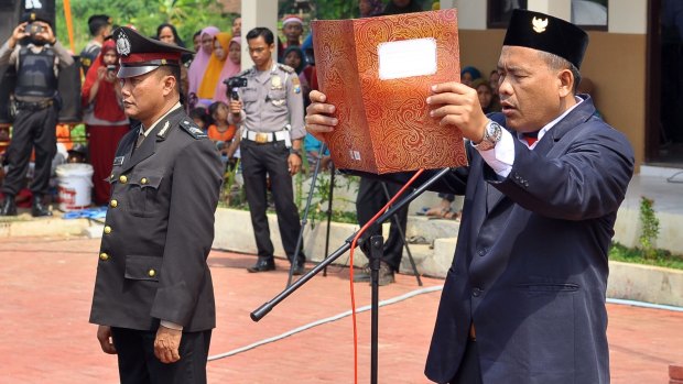 Ali Fauzi, brother of the Bali bombers and Chairman of the Lingkar Perdamaian Foundation reads the proclamation of independence of Indonesia in Tenggulun on Thursday.