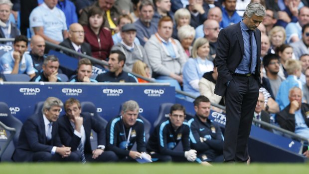 Looking to bounce back: A dejected Jose Mourinho on the sidelines.