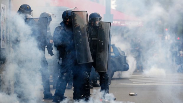 Tear gas enveloped the streets in Paris.