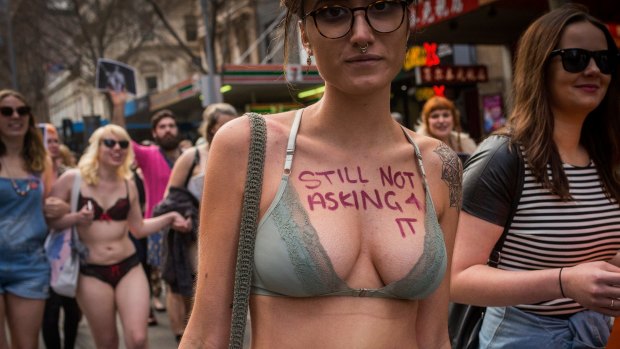 Protesters march in the annual SlutWalk along Swanston Street.