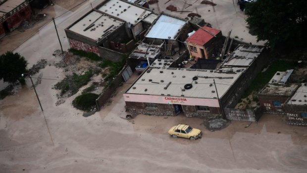 Road are covered in mud after a landslide triggered by a storm in the village of Volcan, Argentina.