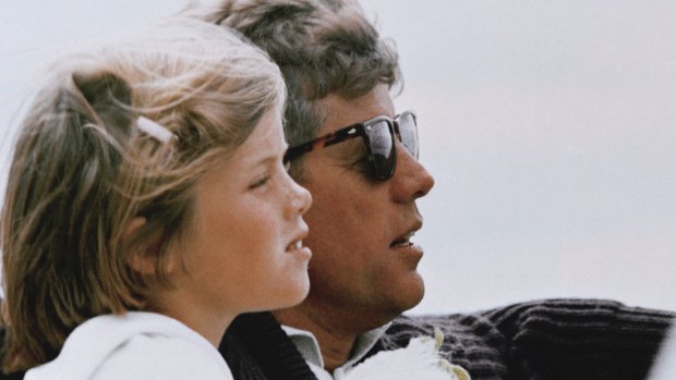 President John F. Kennedy and his daughter, Caroline, sail off Hyannis Port, Massachusetts.
