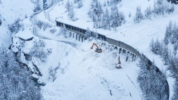 A digger at work where an avalanche has blocked the road between Taesch and Zermatt.