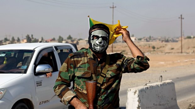 A fighter with Popular Mobilisation Forces stands guard in Tuz Khormato 210 kilometres north of Baghdad, Iraq.