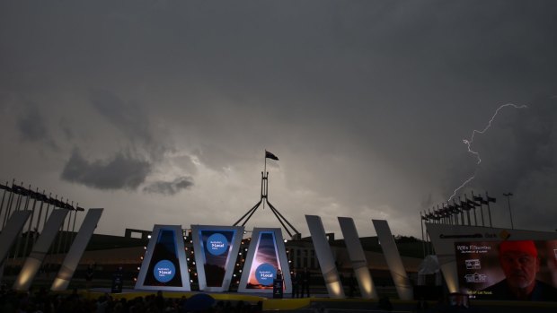 A storm passes over Australian of the Year ceremony.