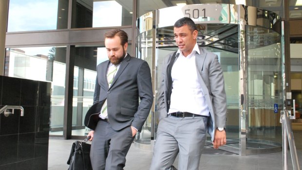 Daniel Kerr and his lawyer Rhett Williamson leave court. 