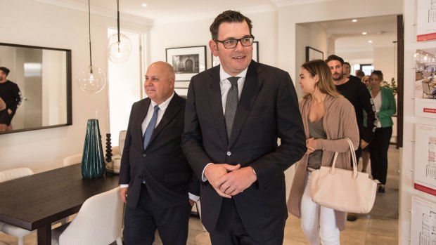 Premier Daniel Andrews with Treasurer Tim Pallas meeting first home buyers Polly Pleban and Tom Quick.