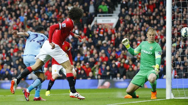 Marouane Fellaini beats Joe Hart to score United's second goal at Old Trafford.