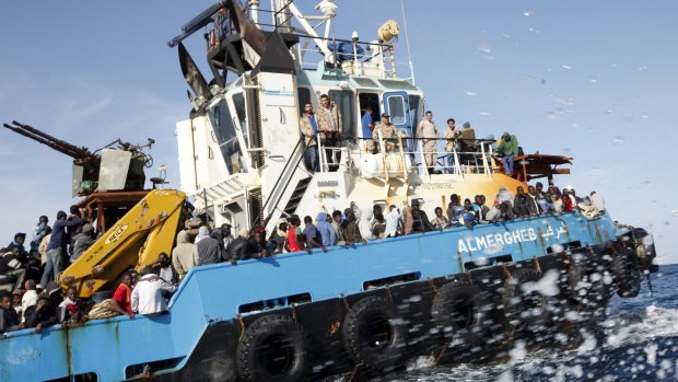 A Libyan Navy boat carries asylum-seekers back to the coastal city of Misrata.