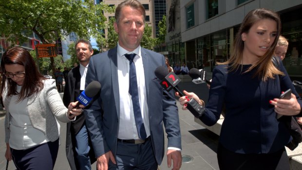 Ex-footballer Glenn Archer leaving the County Court in Melbourne on Tuesday.