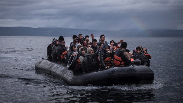 Migrants arrive by boat from Turkey on the northeastern coast of Lesvos, Greece in 2015.