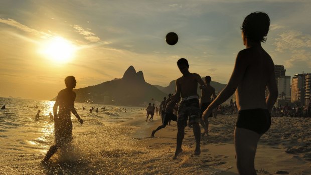 Soccer at sunset, Ipanema Beach, Rio de Janeiro, Brazil.