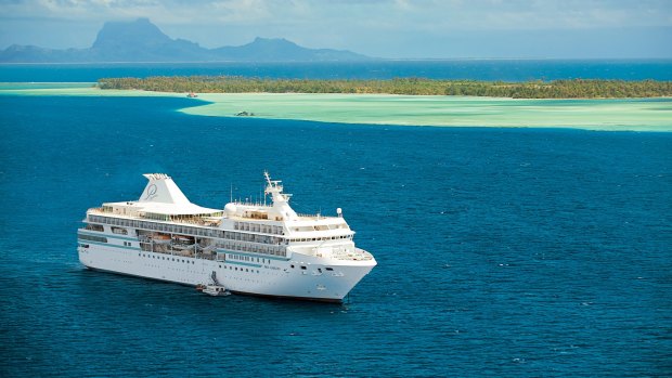 Paul Gauguin sailing in French Polynesia. The ship's small size allows her to maneuver from deep seas to shallow lagoons as nimbly as a yacht.  