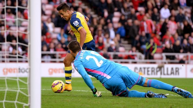 Alexis Sanchez scores his second goal for Arsenal.