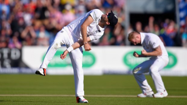 England's Jimmy Anderson throws the ball in the air in celebration after taking a catch, off the bowling of Ben Stokes (right), to dismiss Australia's Adam Voges just before the end of day two of the first Ashes Test in Cardiff.