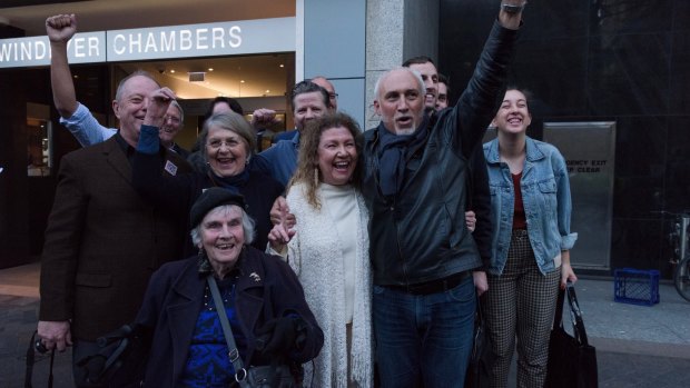 Save Our Sirius campaigners celebrate the win outside court. 
