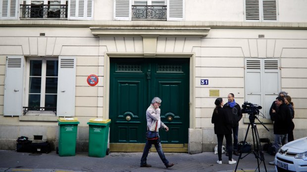 The entrance of the Paris apartment building where police found an explosive device.
