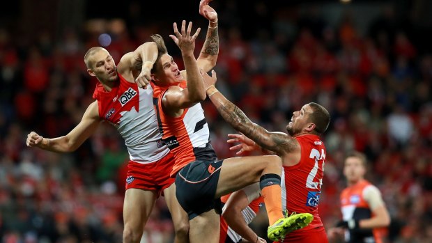 Marking duel: Rory Lobb of the Giants competes against Sam Reid and Lance Franklin.