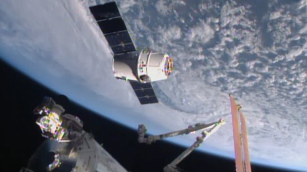 SpaceX Dragon-6 resupply capsule holds at the grapple point, 10 metres from the International Space Station.