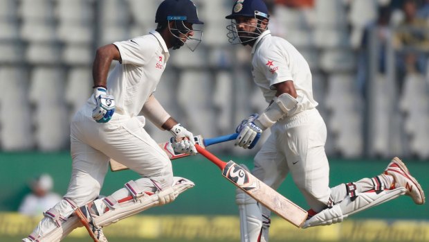 Big partnership: Murali Vijay, right, and Cheteshwar Pujara chase down England's total on the second day of the fourth Test.